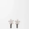 Flor küpeler, gümüş ve kristallerden yapılmıştır. Gümüş/Şeffaf