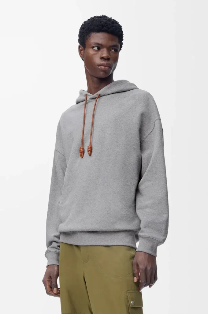 Geniş kesim pamuklu gri melanj kapüşonlu sweatshirt
