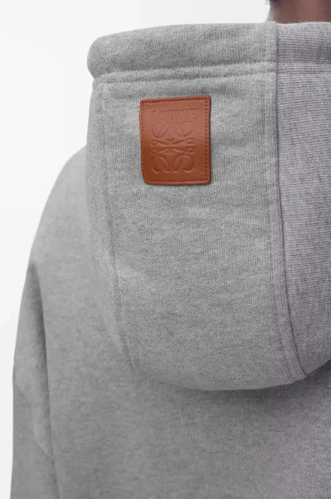 Geniş kesim pamuklu gri melanj kapüşonlu sweatshirt