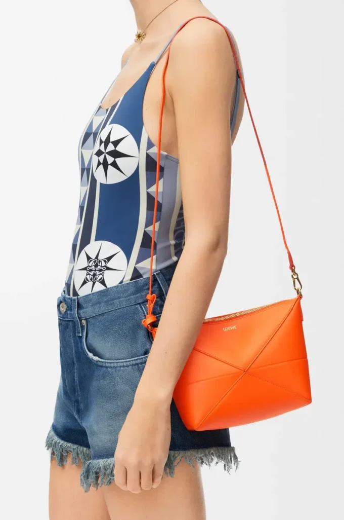 Parlak nappa dana derisinden Puzzle Fold kese Vivid Orange